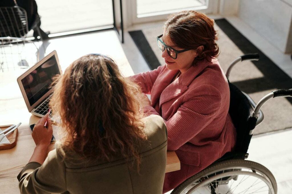 person with disability looking at website on laptop